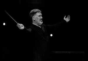 Conductor on stage. Photo.