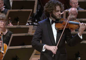 Man with a violin. Picture from the video