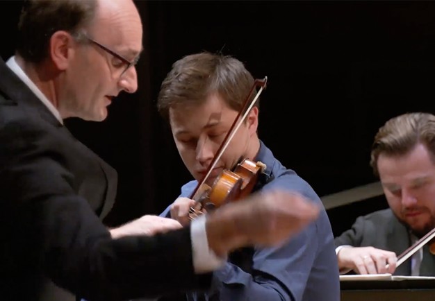 Young man playing the violin. From the movie.